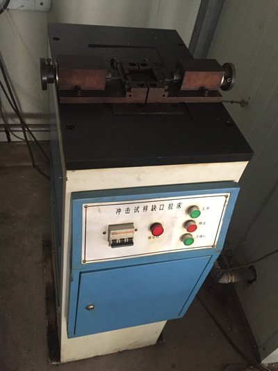 Impact test slotting machine